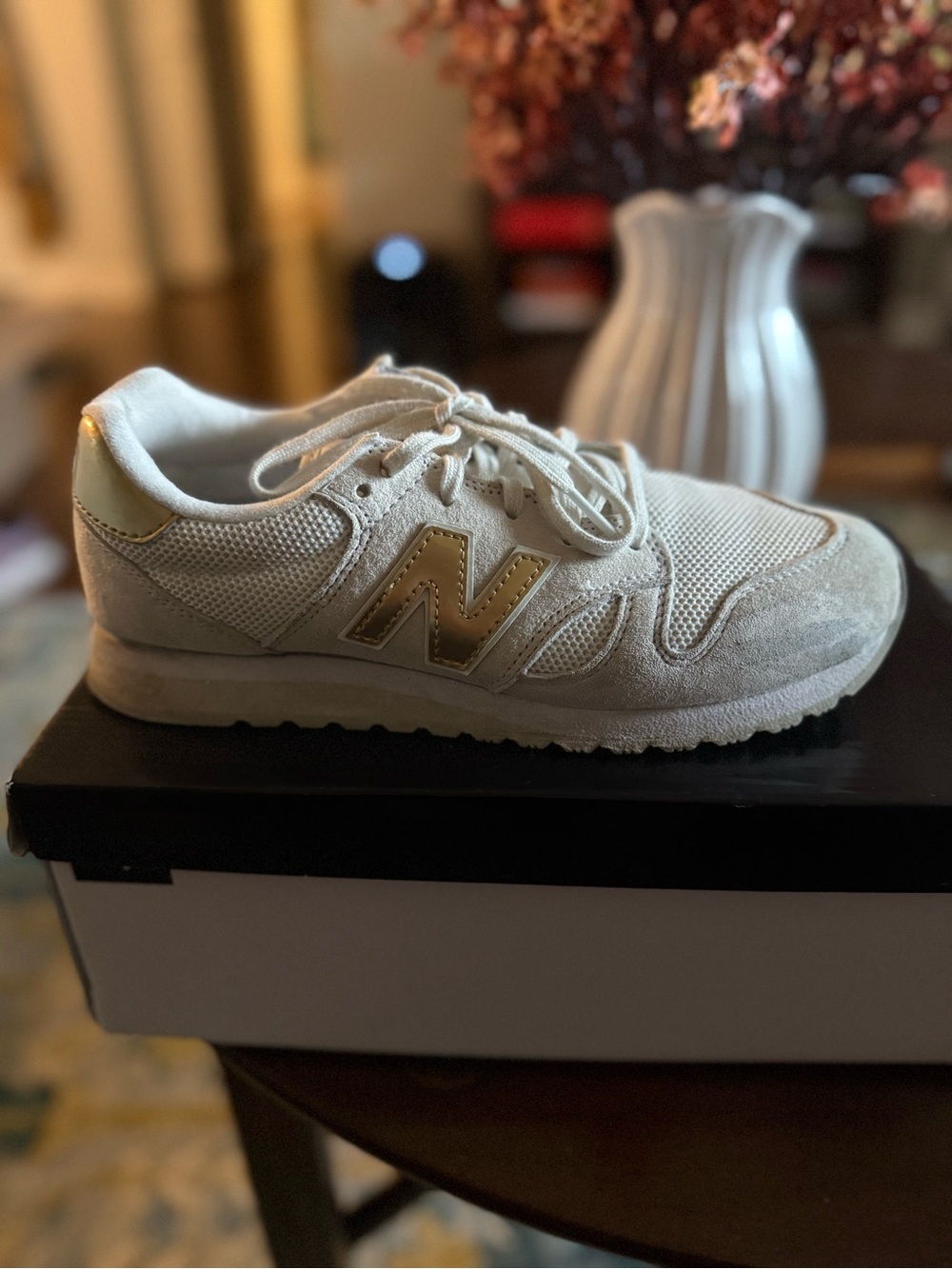 New Balance Cream Sneaker with Gold Accents